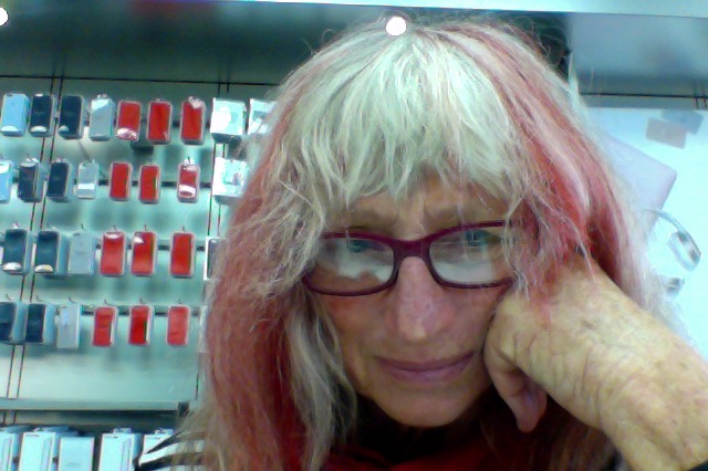 This is how my hair looked at one time -and what a cool identity !I loved having red and blonde streaks falling about my face ,and red glasses to match